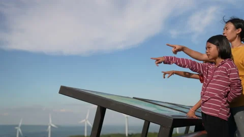 Mother and children read data on board and pointing on blue sky background Stock Footage 219809791