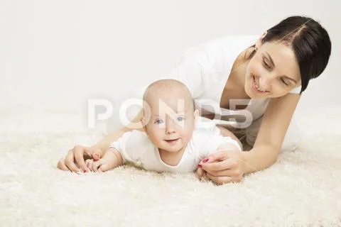 Mother and Crawling Baby, Infant Child Raised Head, Active Kid and Happy Mom Stock Photos