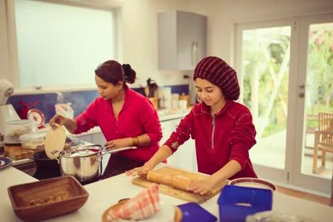 Mother and daughter cooking in kitchen 스톡 사진