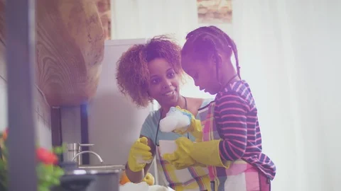Mother and daughter doing housework Stock Footage 106988976