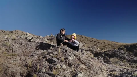 Mother and daughter drinking mate in Tafi del Valle Argentina during family Stock Footage 340150155