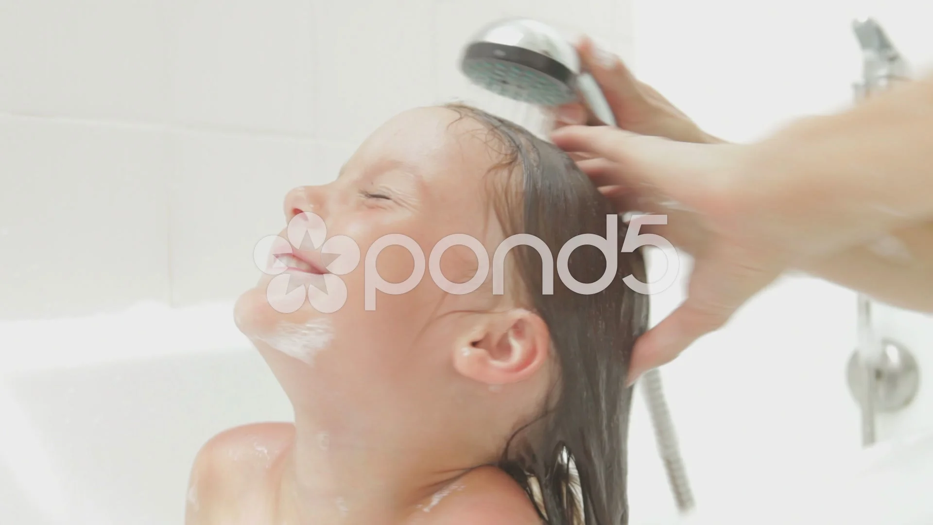 Mother And Daughter Enjoying Bath Time