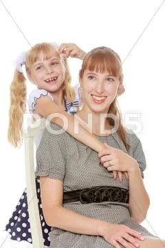 Mother and daughter hugging Stock Photos
