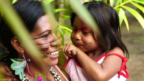 Mother and Daughter at an indigenous tribe in the Amazon Stock Footage