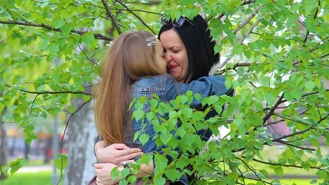 Mother and daughter kissing and hugging ... | Stock Video