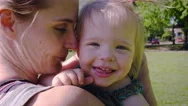 Mother And Daughter Laughing In Park Stock Footage