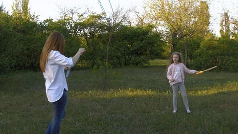 Mother and daughter in the park on a spring walk Stock Footage 105260853