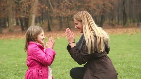 Mother and daughter playing clapping game Stock Footage 59554159