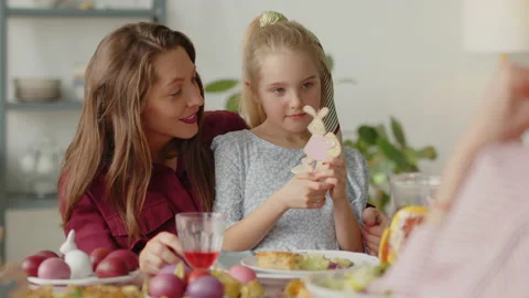 Mother and Daughter Playing with Easter Toy on Dinner Stock Footage 224563497