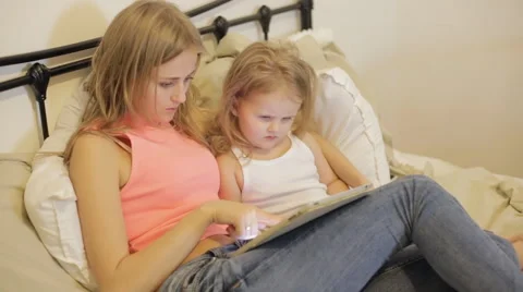 Mother and daughter playing with tablet Stock Footage 59115140