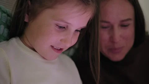 Mother and Daughter Using Digital Tablet at Home 库存影片 344248665
