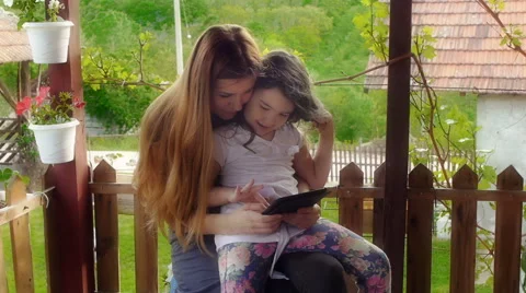 Mother and Daughter Using Tablet Stock Footage 45185348