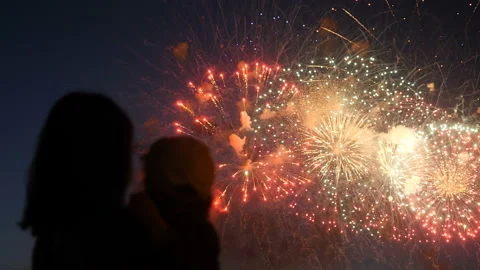 Mother and daughter watching fireworks. Stock Footage