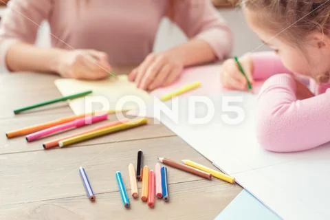Mother and daughter weekend together at home education concept drawing close-up Stock Photos