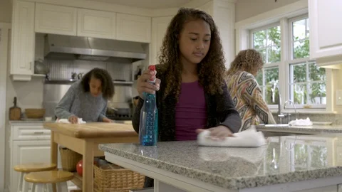 Mother and daughters cleaning kitchen. Stock Footage 88175430