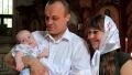 Mother and father with baby in orthodox church HD Footage