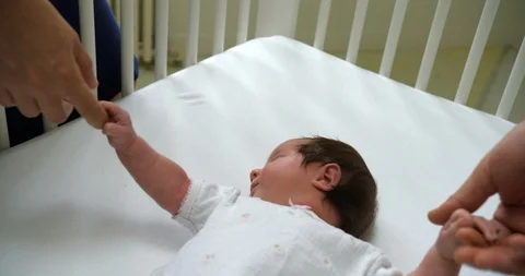 Mother and father holding their babys hand 스톡 동영상 88372953