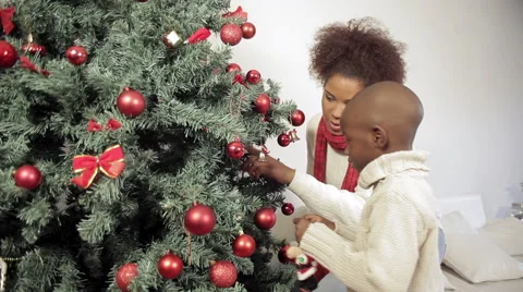 Mother and her child preparing Christmas tree Stock Footage 44295825