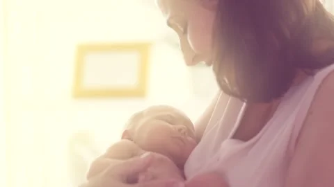 Mother and her Newborn Baby. Happy Mother holding her New born Baby girl Stock Footage