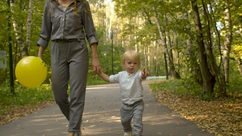 Mother and her son walking hand in hand Stock Footage 121962273