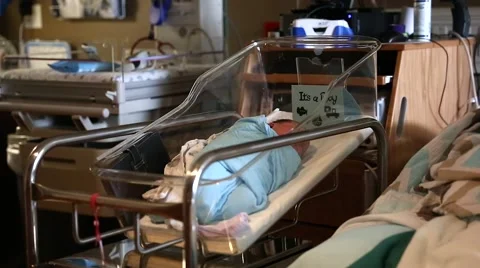 A mother and her tiny newborn in hospital dolly shot Video stock 44524512