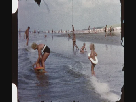 Mother And Her Twins Playing With Waves Stock Footage 80619338