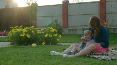 Mother and Little Son Using a Smartphone Stock Footage 56251079