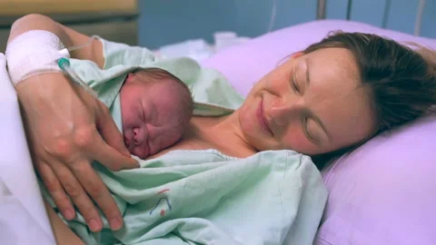 Mother and newborn. Child birth in maternity hospital. Stock Footage