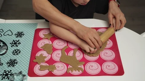 Mother and small son getting ready for christmas, baking gignger cookies Stock-Footage 99622446