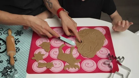 Mother and small son getting ready for christmas, baking gignger cookies Stock Footage 99624088