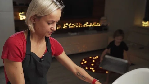 Mother and small son getting ready for christmas, baking gignger cookies Stock-Footage 99624615