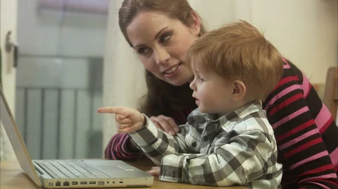 Mother and small son using a laptop, Sweden. Stock Footage 51858113
