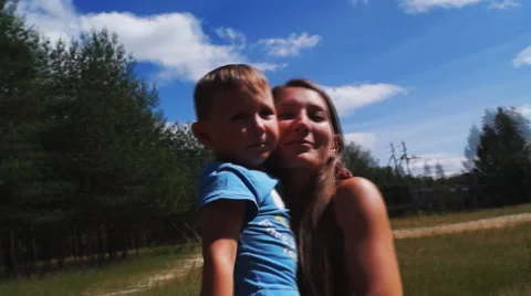 Mother and son around on Steadicam Stock Footage 54661953
