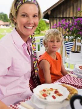 Mother and son at breakfast table Stock Photos