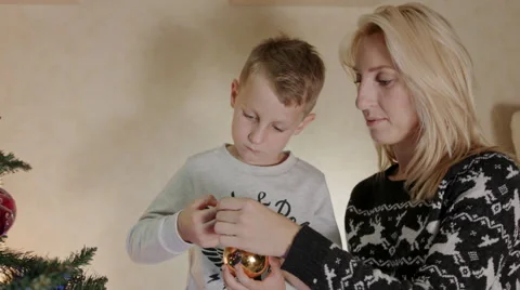 Mother and son decorating Christmas tree Stock Footage