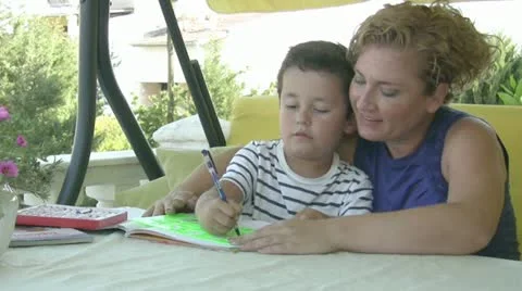 Mother and son doing homework 스톡 동영상 11705307