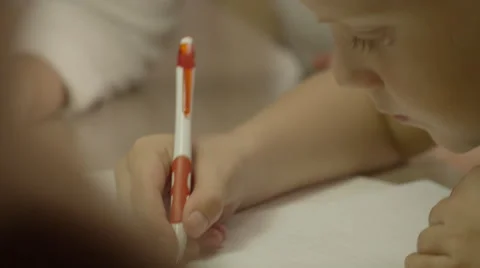 Mother and son doing homework and getting ready for school Stock Footage 62915571
