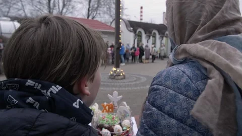 Mother and son at the Easter holiday in the Orthodox Church close-up Video stock 238848582
