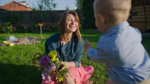 Mother and Son Having Fun on the Lawn Stock Footage 56240245