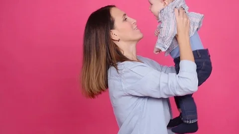 Mother and son having fun indoors Video stock 82972950
