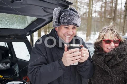 Mother And Son Having Hot Drink Outside In Winter