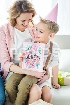 Mother and son holding greeting card Stock Photos