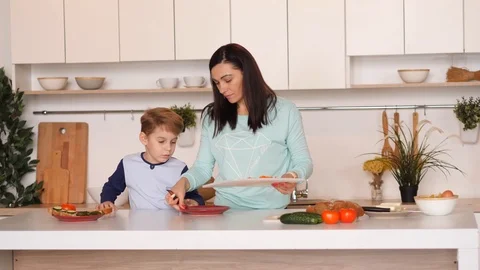 Mother and son in the kitchen Stock Footage 89333300