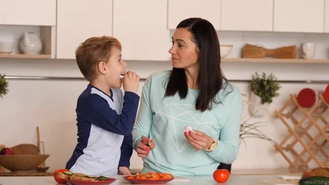 Mother and son in the kitchen Video stock 89333891