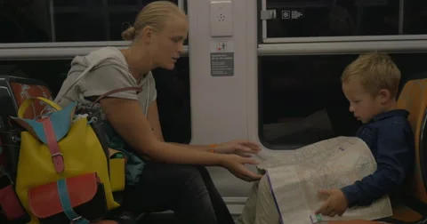 Mother and son looking at map in the train Video stock 64881746