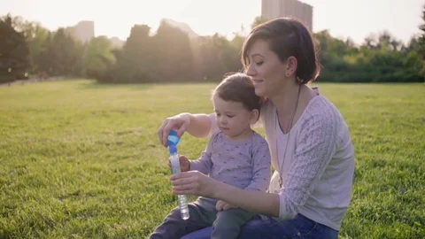Mother and son Making bubbles Stock Footage 75205871