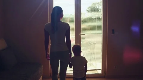 Mother and son open the window rural house Stock Footage 82843772