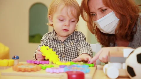 Mother and son play at the table Stock Footage 144240065