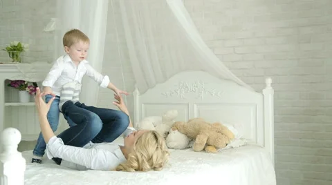 Mother and son playing on the bed. Stock-Footage 62346344