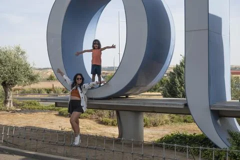 Mother and son posing on the Olvera letters landmark sign during summer hol.. Stock Photos